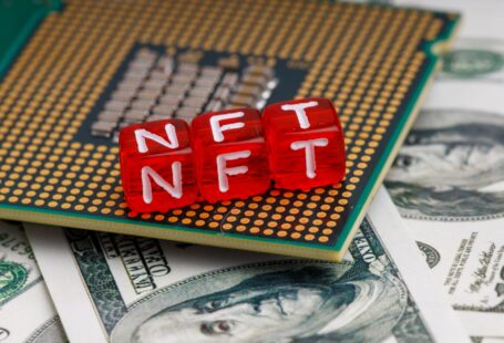 nft letters on processor and dollars