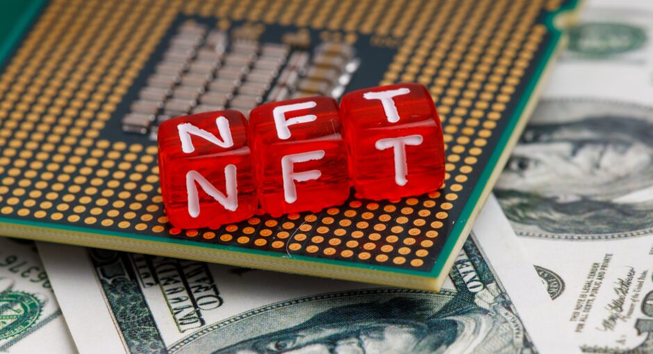 nft letters on processor and dollars
