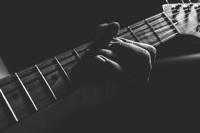 person holding an accord on guitar