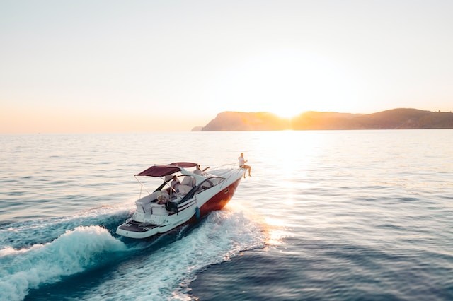 persons riding on a small yacht