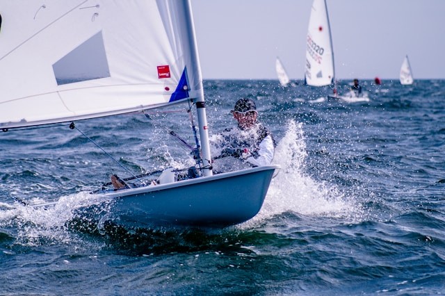 man-riding-sailboat