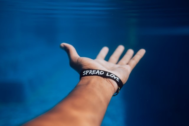 person-wearing-black-silicone-bracelet