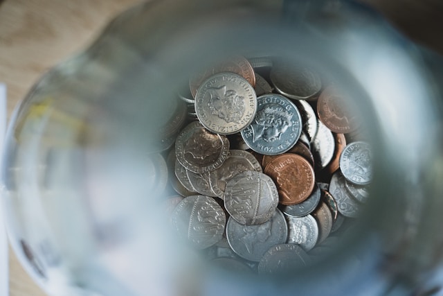 silver-round-coins-on-blue-round-container