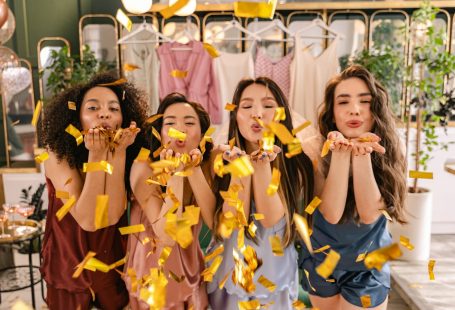 women-blowing-confetti