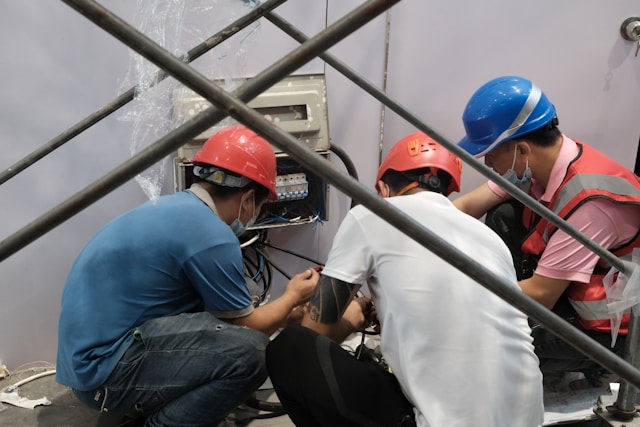 a-group-of-people-wearing-hard-hats