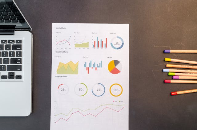 charts-on-black-wooden-table